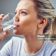 Young Woman Drinking Purified Water